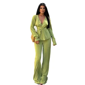 Elegant green pleated two-piece set featuring a wrap long sleeve top and wide leg trousers