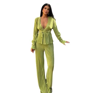Elegant lime green pleated two-piece set featuring wrap top and wide-leg trousers for women