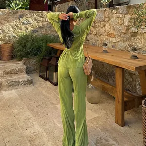 Detailed back view of stylish lime green pleated two-piece set for plus size women