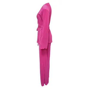 Side view of fuchsia pink pleated long-sleeve top and trousers casual loungewear set