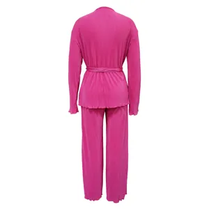 Back view of a vibrant fuchsia pleated long-sleeve top and matching pants two-piece set