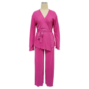 Front view of fuchsia pleated loungewear set featuring wrap top and wide leg pants