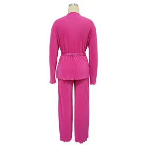 Back view of hot pink pleated long-sleeve top and trousers set for women