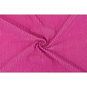 Macro view of bright magenta pleated fabric showing a detailed vertical plissé texture