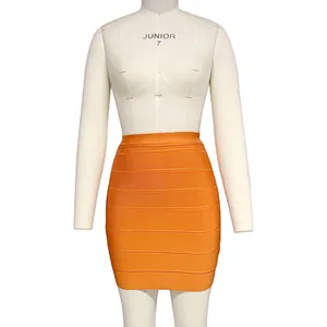 Detailed view of women's orange bandage bodycon mini skirt highlighting ribbed texture