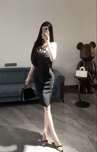 Detailed view of a sexy black bandage bodycon dress with strappy neckline