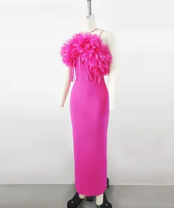 Detailed view of hot pink bandage maxi dress featuring a 3D floral feather neckline