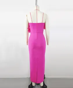 Detailed back view of a hot pink bandage maxi dress with elegant floral side accents