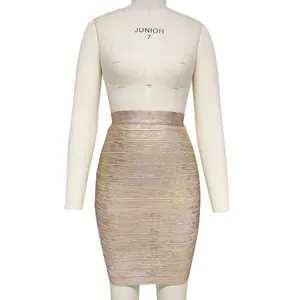 Close-up detail of a sparkling gold metallic bandage bodycon mini skirt on mannequin