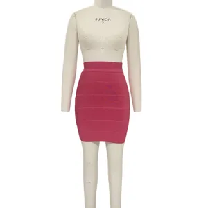 Close-up of pink bandage mini skirt on a mannequin showing tight fit and texture