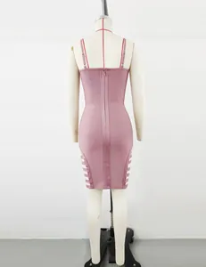 Back view of sexy mauve bandage bodycon dress with zipper and side cutouts.