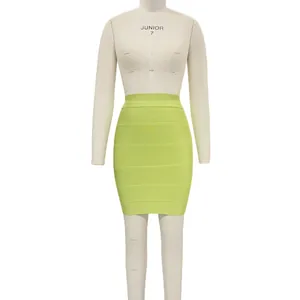 Detail shot of a lime green bandage bodycon mini skirt on a white studio mannequin