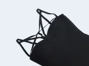 Close-up of black bandage bodycon dress featuring sexy criss-cross strap design.