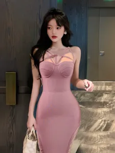 Elegant pink bodycon bandage dress with unique criss-cross strap neckline design