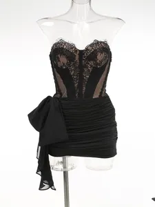 Elegant black lace corset mini dress featuring a mesh overlay and decorative side bow
