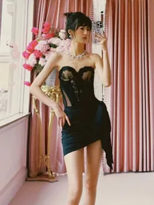 Chic black lace sheer mesh tube-top bodycon mini dress worn by a model