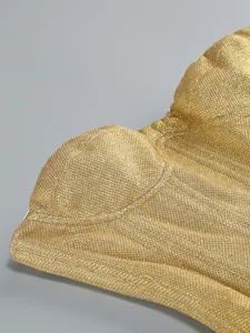 Close-up detail of golden glitter sequined tube top dress showing the fabric texture