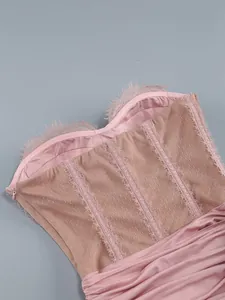 Close-up detail of sexy pink lace mesh tube top dress showing delicate lace trim