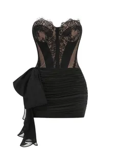 Close-up of black lace corset bodice and ruched skirt with oversized side bow