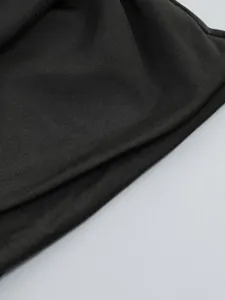 Detailed close-up view showing the fine texture of black elastic mesh fabric for dresses.