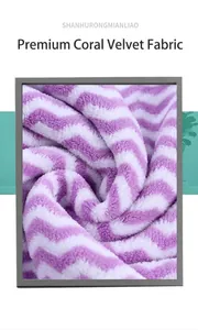 Macro view of purple and white chevron pattern coral fleece towel fabric texture details