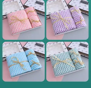 Gift box set containing three microfiber towels with chevron pattern in four colors.