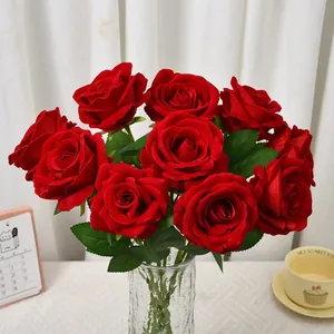Vibrant red velvet artificial roses in a clear glass vase for elegant home decor