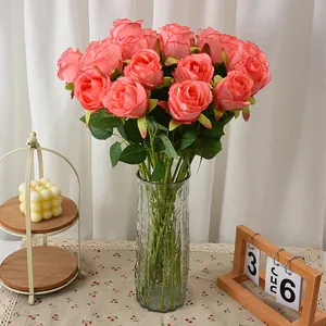 Lush coral velvet artificial roses bouquet in elegant glass vase for home wedding decor