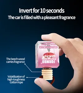 Détail en gros plan du désodorisant de voiture FORMBO montrant le mode d'inversion