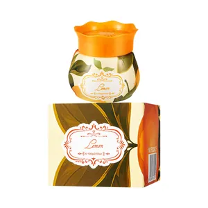 Solid lemon scented air freshener for car and home with decorative orange floral lid