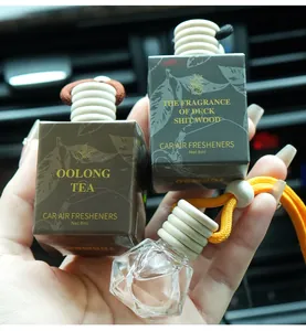 Detailed view of car air freshener hanging bottles with wood caps and gift boxes