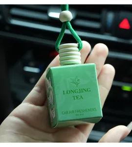 Close-up of Longjing Tea scented car air freshener hanging bottle in green packaging