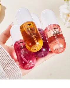 Close-up of four colorful FORMBO alcohol-free body spray bottles held in a hand
