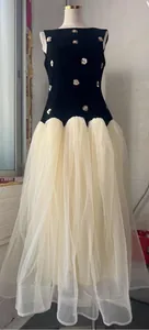 Detail of sleeveless Hepburn style dress with velvet top and layered tulle skirt