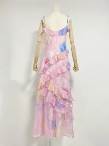 Elegant pink floral resort maxi dress back view featuring stylish layered ruffles