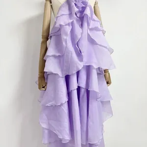 Close-up detail of tiered lavender ruffles on a French style irregular hem maxi dress