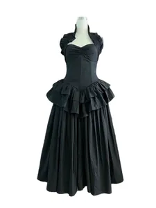 Elegant black halter neck dress with corsetry bodice and tiered pleated skirt