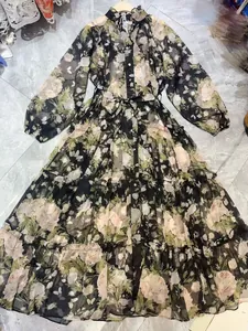 Floral V-neck long sleeve dress featuring button-down front and tiered skirt detail