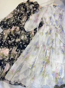 Elegant floral V-neck maxi dress with lantern sleeves and tiered skirt detail