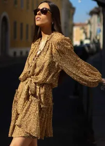 Elegant leopard print V-neck dress with lantern sleeves and a flattering waist tie detail.