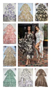 Detail view of elegant v-neck floral dresses with lantern sleeves and tiered skirts