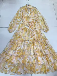 Full view of floral V-neck tiered maxi dress with lantern sleeves and belted waist.