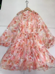 Elegant floral print V-neck dress with lantern sleeves, button-down and belted waist.