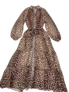 Elegant leopard print V-neck tiered maxi dress with lantern sleeves and waist tie