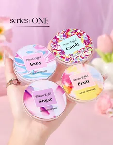 Close-up detail showing four colorful scents of portable ladies solid perfume balm tins.