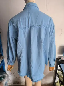 Back view detail of oversized distressed denim shirt jacket on mannequin for women