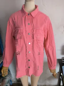 Front view of pink distressed denim jacket showing frayed edges and ripped details