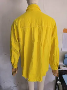 Back view of a vibrant yellow oversized distressed denim jacket for women details