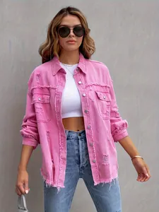 Close-up detail of women's pink distressed denim jacket with frayed edges and ripped accents