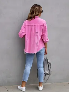 Back view of a vibrant pink distressed denim jacket with frayed hem and ripped details